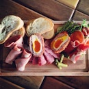 Cold cuts platter with three meats and one Scotch egg that stole the limelight.