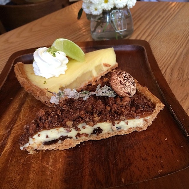 White chocolate pudding pie with raisins, cookie crumble, candied thyme, mushroom meringue, drizzled with truffle oil.