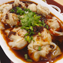 Spicy dumplings in hot sour sauce