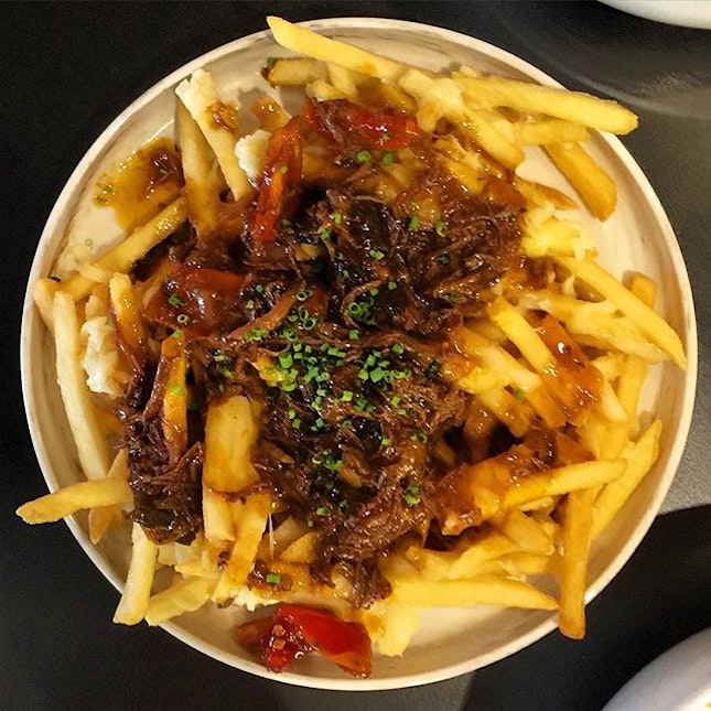 Poutine - Shoestring fries, melted cheese and saucy braised beef cheek at @ninjabowl .