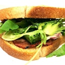 McDean Sandwiches lunch special; beef pastrami with sundried tomato cream cheese & romano salad on wholemeal slices.