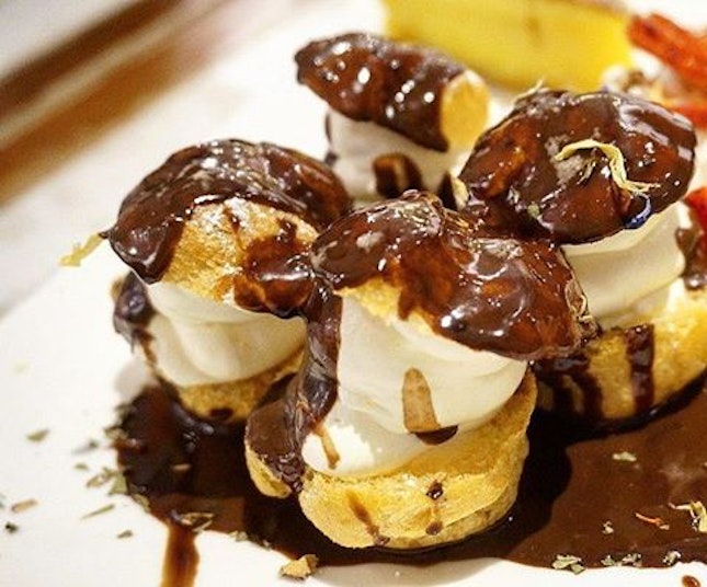 One of my favourite desserts - profiteroles with ice cream and drenched with chocolate sauce!