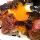 Wagyu, Shaved truffle, poached egg on rice, $97