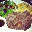 Rib Eye and Golden Fries with a small portion of salad.