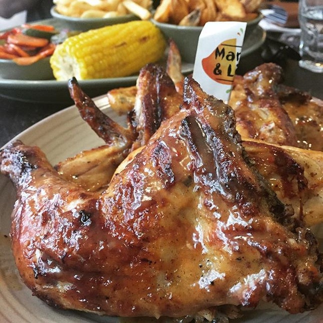 #burpple | a full platter of a whole #grilledchicken in mango & lime seasoning and sides of corn, grilled veggies, potato fries and potato wedges.