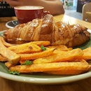 Toasted Honey Ham and Cheese Crossiant, served with sweet potatoe fries.