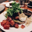 Avocado Hummus Toast, Poached Eggs, Honey Candied Bacon and Dukkah ($18+$5)