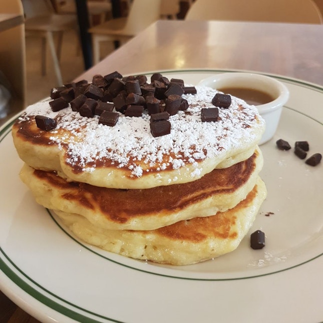 Pancake stack with chocolate chunks and maple butter