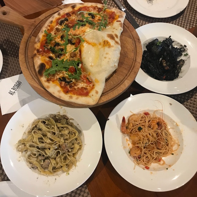 Al Borgo Pizza ($32), Capellini con Gamberi ($32), Fettucine con Salsicca e Tartufo ($30), Risotto al Nero di Sippia ($30)