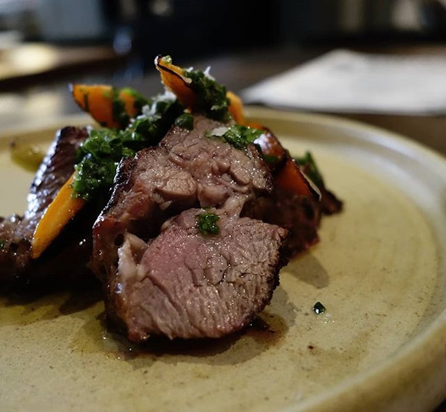 Chargrilled lamb neck with a parsley gremolata and baby carrots
.