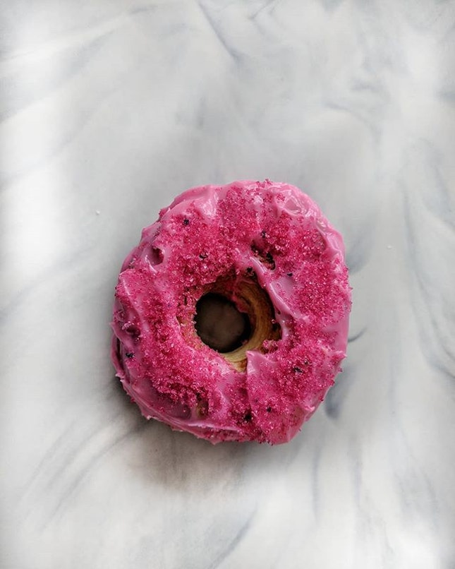 Cereal's Citizen take on the 脏脏包 aka Dirty bun is a crododo topped with a pink glaze and sprinkled with pink sugar.