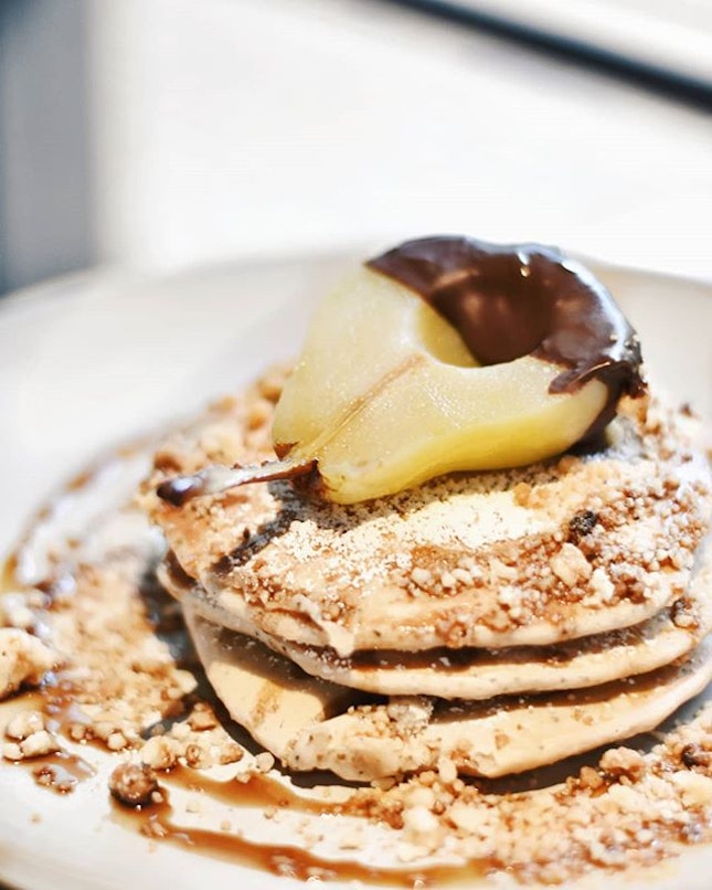 Scrumptious 🥞🍐 EARL GREY PANCAKES WITH POACHED PEAR

Unique and still one of Punch's most prominent dish are it's earl grey flavoured pancakes topped with macadamia crumbles and a half coated chocolate poached pear.