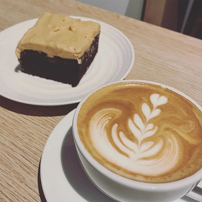 A cappuccino (skinny, why waste calories!) and a slab of peanut butter and chocolate brownie!!