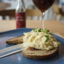 The Scramble | sour cream scrambled eggs on toasted country rye with spring onion