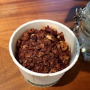 [📍Revisiting Oatberry Granola Kitchen - Part 2/2 ]
Greedy me got another bowl of @theoatberry quick bowl:
𝗗𝗮𝗿𝗸 𝗖𝗵𝗼𝗰𝗼𝗹𝗮𝘁𝗲 𝗰𝗼𝗰𝗼𝗻𝘂𝘁 𝗺𝗶𝗹𝗸 𝗶𝗰𝗲 𝗰𝗿𝗲𝗮𝗺 𝘁𝗼𝗽𝗽𝗲𝗱 𝘄𝗶𝘁𝗵 𝗯𝗹𝗮𝗰𝗸𝗳𝗼𝗿𝗲𝘀𝘁 𝗴𝗿𝗮𝗻𝗼𝗹𝗮-($6)
-I usually get their greek yogurt but decided to try the dark chocolate coconut milk ice cream  because i prefer my greek yogurt plain but they only offer vanilla flavour (which is nice but I think plain ones complement the granola better as vanilla tends to mask the toasty fragrance of granola; and also because vanilla flavour has sugar and flavourings).