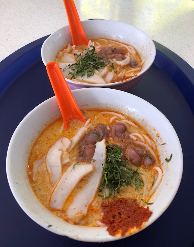 Charcoal laksa warms the cockles of our hearts.