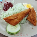 Nasi Lemak with fish fillet and sunny side up.