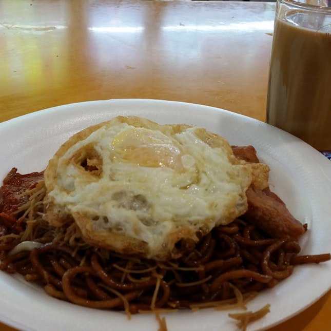 Breakfast of fried #beehoon & #mee with a #fried #egg & a slice of fried #luncheon #meat.