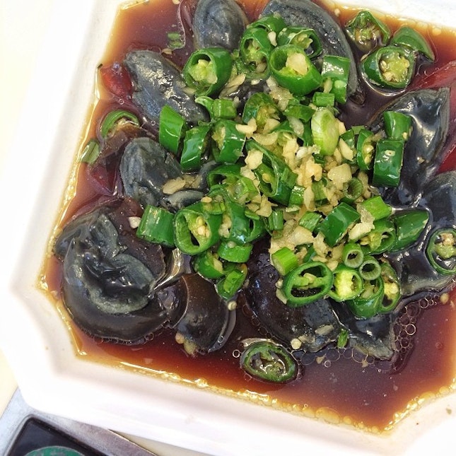 Century egg with watery yolk topped with garlic, spring onions and green chili is the winner!