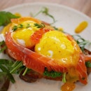 Egg Mikado--2 poached eggs on sourdough with house cured salmon and orange hollandaise sauce.