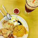 Curry rice with chicken cutlet and egg with red tea.