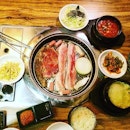 Pork belly, beef, sausages,  plenty of side dishes, steamed egg, kimchi soup.
