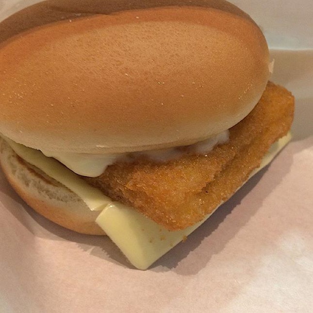 The fried fish fillet filled with mayonnaise, chopped onions and cheese, sandwiched by soft buns.