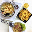 Seafood Baked Rice, salted egg yolk fries and smoked duck Aglio olio.