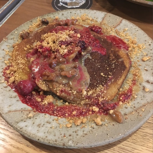 Pancakes with Caramelised Bananas, Walnuts, Salted Caramel Sauce, Nutty Crumble And Berry Coulis