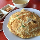 Fried rice with wrapped egg omelet.