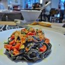 Squid Ink Pasta with a Crab and Tomato Sauce

I'm not a big fan of squid ink pasta but this one had something special about it.