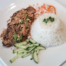 Grilled pork chop rice ($15.90++ set lunch) comes with a drink & chicken salad..