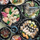 Sashimi, Sushi and Japanese Dishes feasting at home.