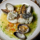 'Crazy water’ seabass, clams, light tomato broth.