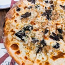 A strong whiff of truffle from the Truffle Shuffle ($18) at Alt Pizza hits you as it arrives as your table.