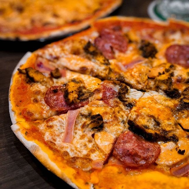 Blasted in a wood-fired oven, the pizzas at Modesto’s are charred and well-flavored.
