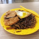 Economic Noodles (2.50)
A plate of Kway Teow Noodles with fish cutlet and egg to kick start the day.