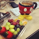 my berries breakfast from caffee macs + tea in mickey pants! on my very messy table!
