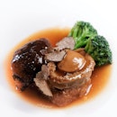 Six-Head South African Abalone with Black Truffle (CNY menu from $138++ onwards).