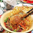Khao Soi, a Northern Thailand egg noodle dish with curry gravy, and crispy fried noodles and shallots adorning this.