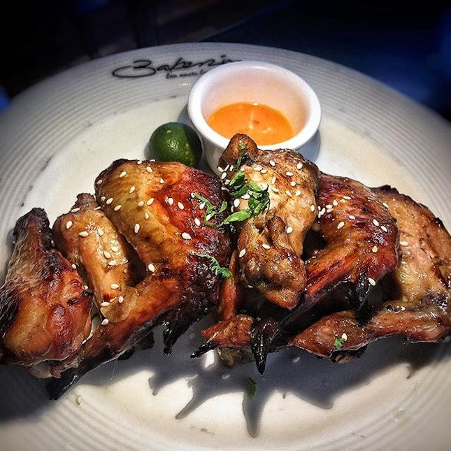 Baked chicken wings SGD 9.90++.