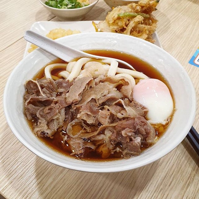 Slurping up this comfort bowl of freshly made chewy Sanuki udon with slices of tender beef.