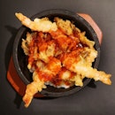 Sizzling hot stone tendon with prawn kakiage and onsen egg in Gochujang chilli sauce.