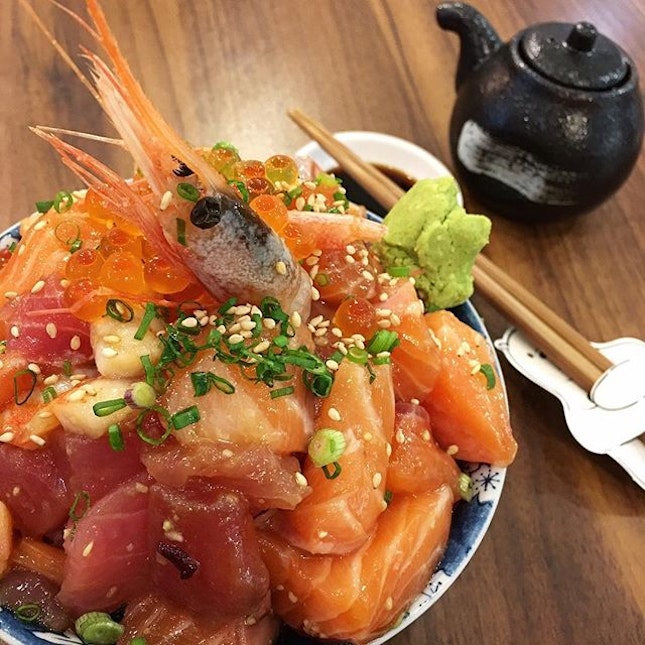 Heaps of sashimi over a bowl of rice.