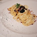 Spaghetti Carbonara di Mare — spaghetti with caviar, mullet roe, crispy bacon and black pepper.