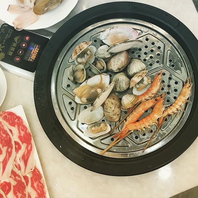 Steamed seafood hotpot on the best porridge bubbling under.