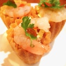 Kueh pie tee, a nonya dish with crispy pastry shells stuffed with thinly sliced vegetables, eggs and prawns.