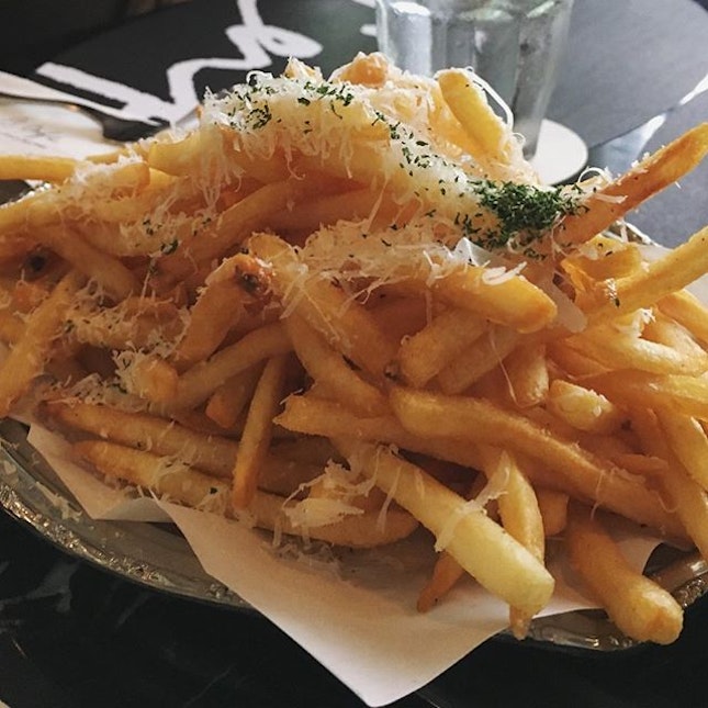 The world feels right when you've got a mountain of truffle fries and an afternoon of doing nothing.