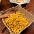 Buttered corn and baked Camembert.