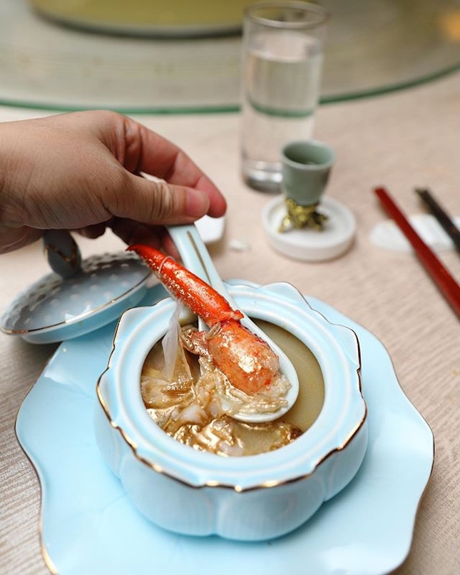 [Peach Blossoms] - A comforting bowl of poached rice packed with robust crustacean flavour is the Poached Rice with Lobster in Imperial Stock served with Crispy Rice.